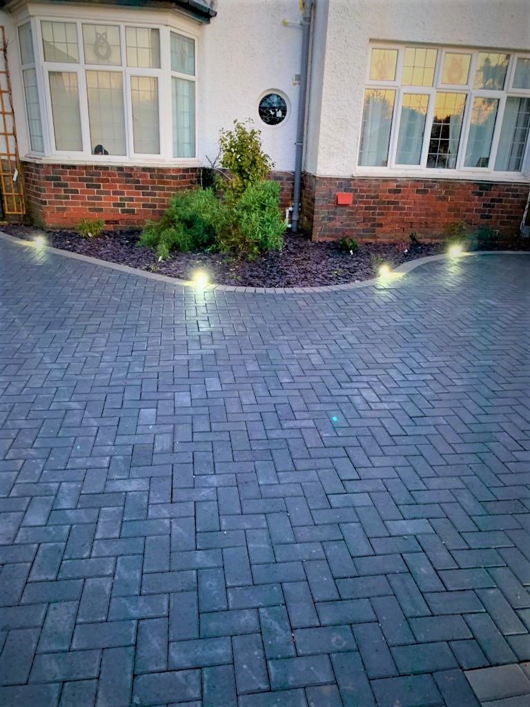Finished block paved driveway with ground lights