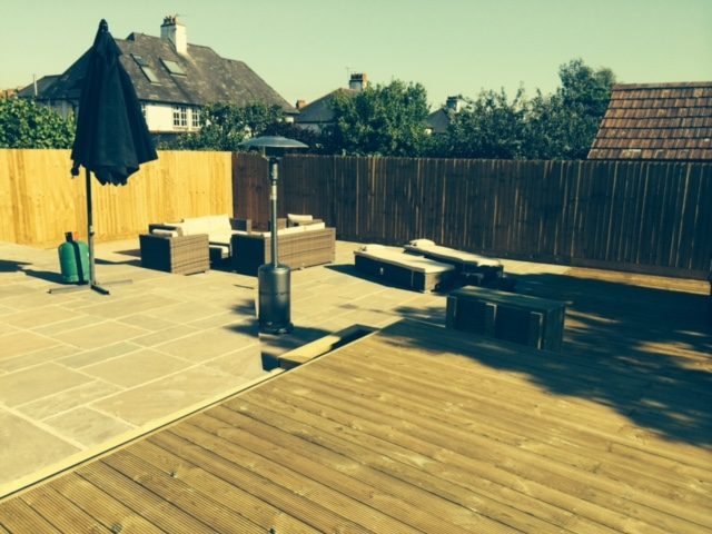 Finished timber deck adjoining a paved seating area