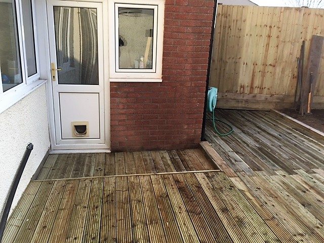 Timber deck built directly outside the rear of a property