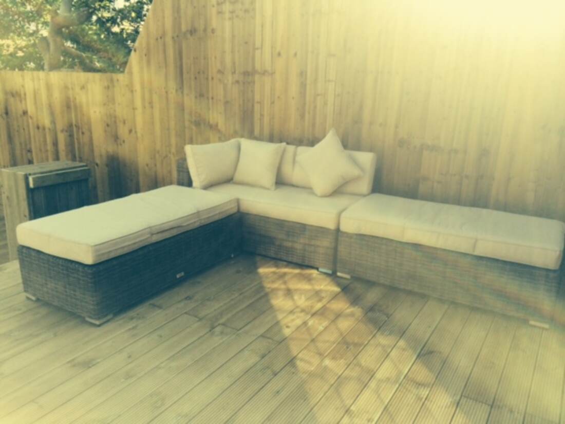 Corner sofa on a finished timber deck