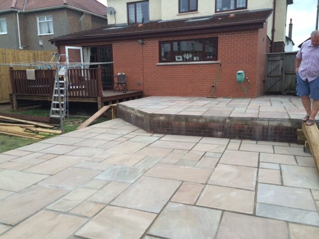 Large light-coloured paved rear garden