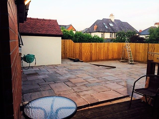 Finished paved rear terrace with timber fencing